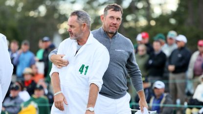 Billy Foster and Lee Westwood on the 18th green during the first round of the 2017 Masters