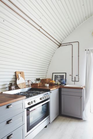 corrugated metal on curved ceiling in kitchen