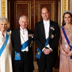 ritain's Queen Camilla, Britain's King Charles III, Britain's Prince William, Prince of Wales and Britain's Catherine, Princess of Wales pose for a picture during a reception for members of the Diplomatic Corps at Buckingham Palace