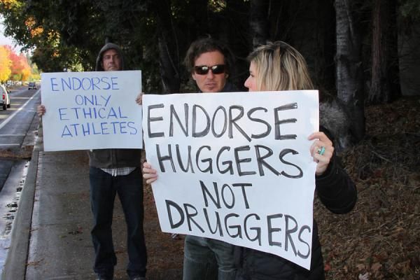 Protesters picket in front of the Nike World Headquarters campus in Beaverton, Oregon, on Oct. 16, 2012