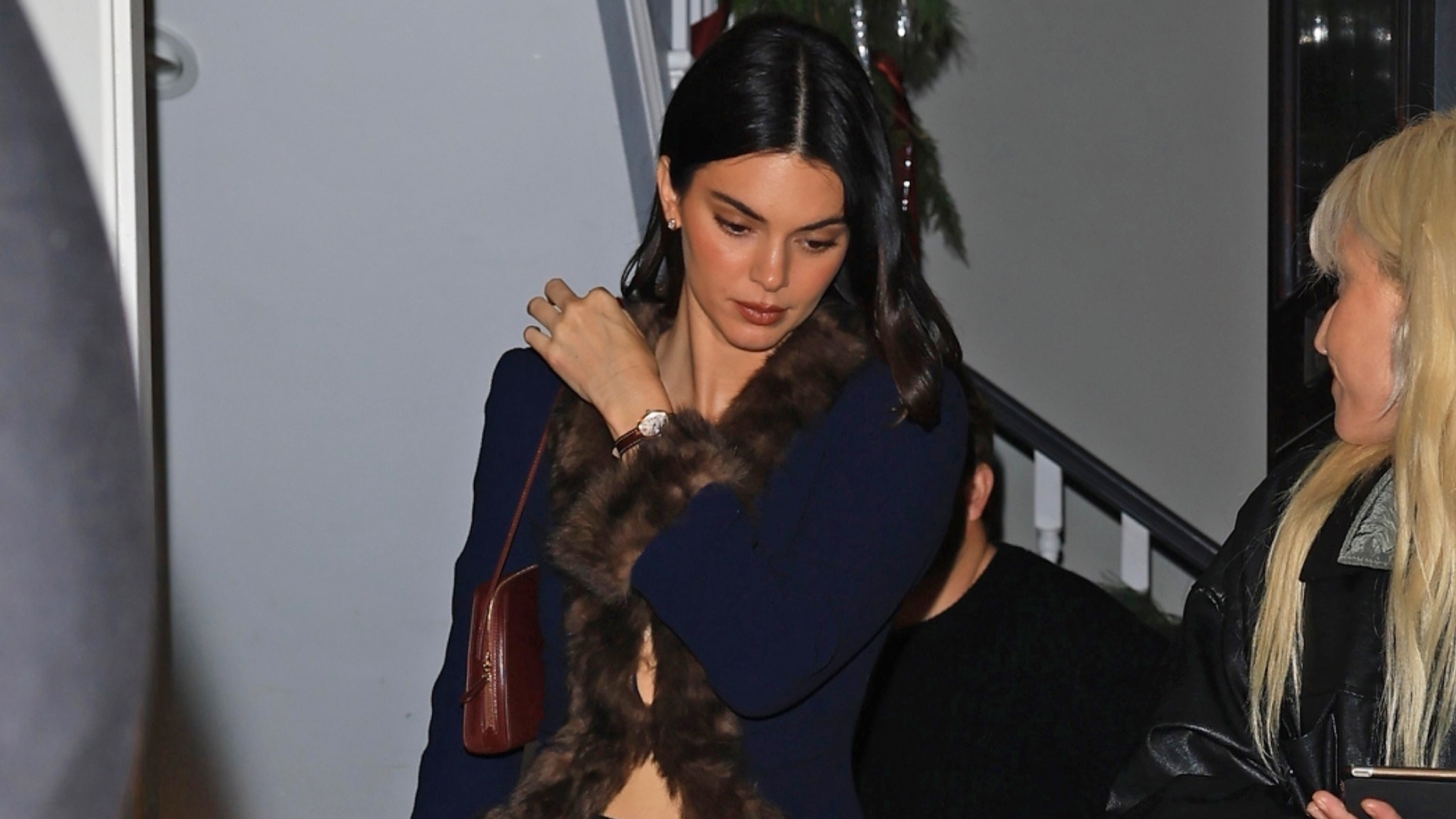 Kendall Jenner attended a holiday party in the stirrup leggings trend, and a Valentino fur-trimmed coat from Jennifer Lawrence's closet