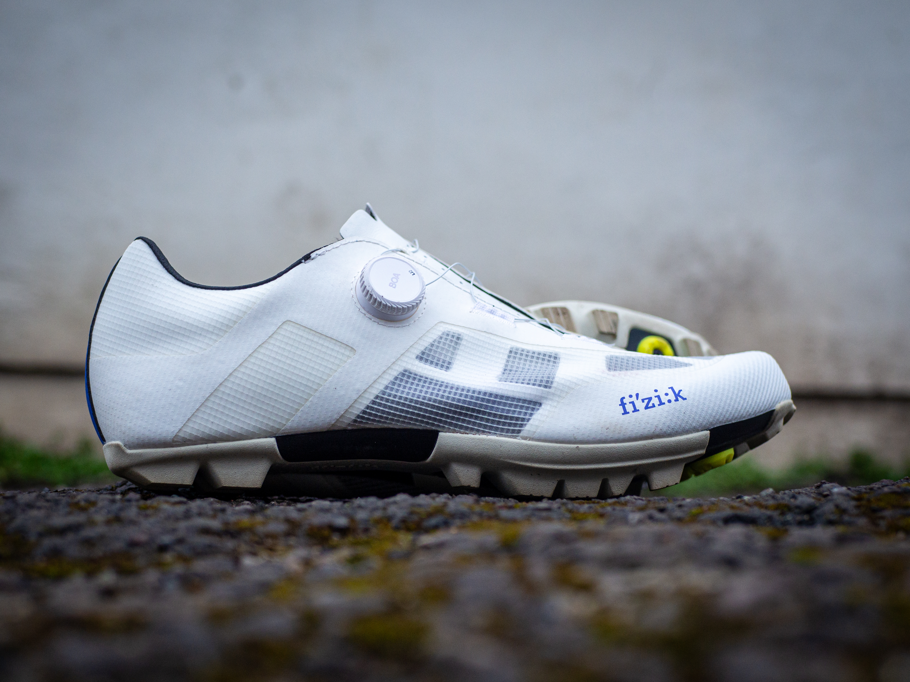 A white pair of Fizik Vento Proxy gravel shoes