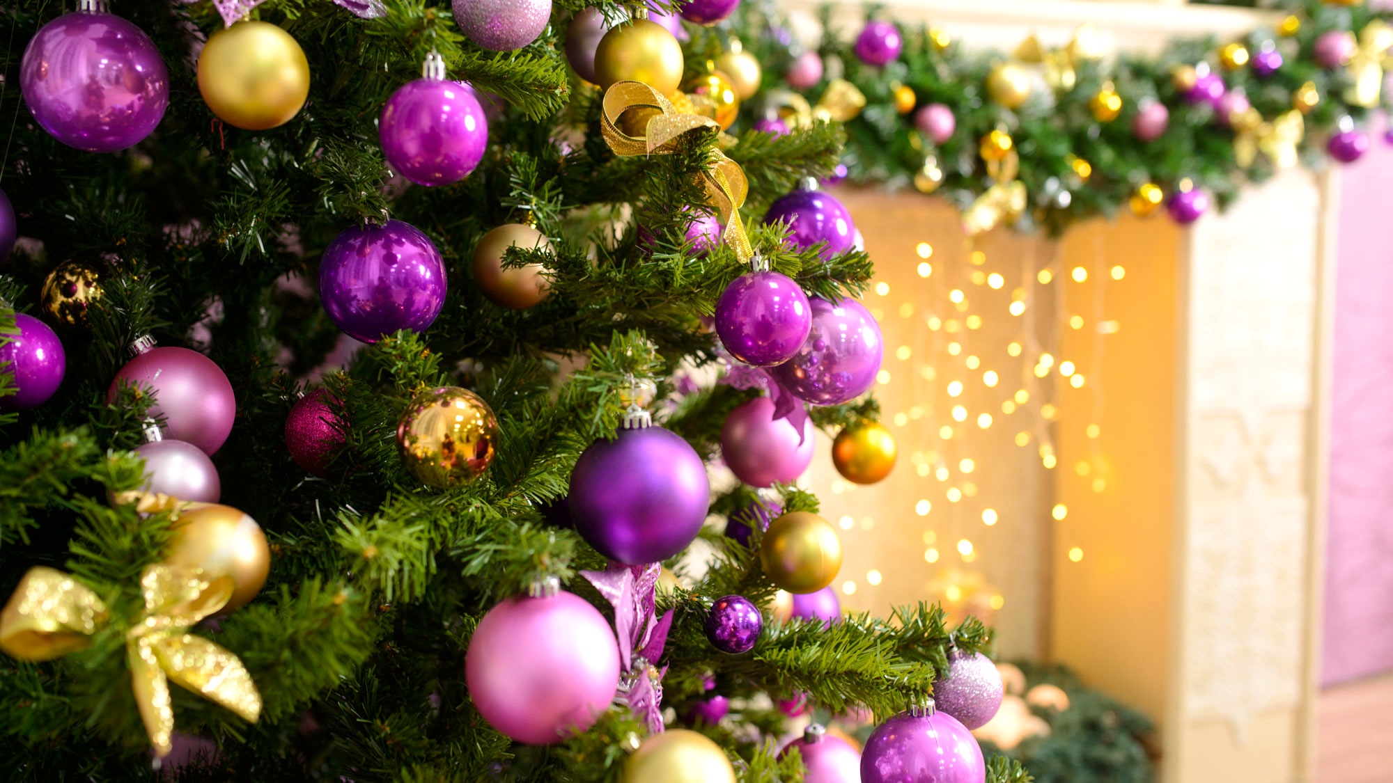 homegrown Christmas tree decorated with pink and gold trim
