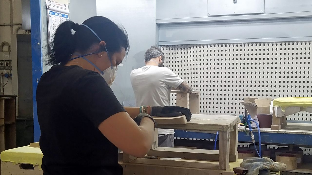 a worker in the sonus faber stereo speaker factory