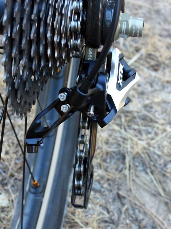 The Shadow-style rear derailleur tucks the mechanicals further in to protect from rock strikes but the more upright cable routing also better protects the housing relative to SRAM.