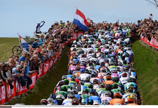 The riders pass cycling fans along the Gulpenerberg at last year's Amstel Gold