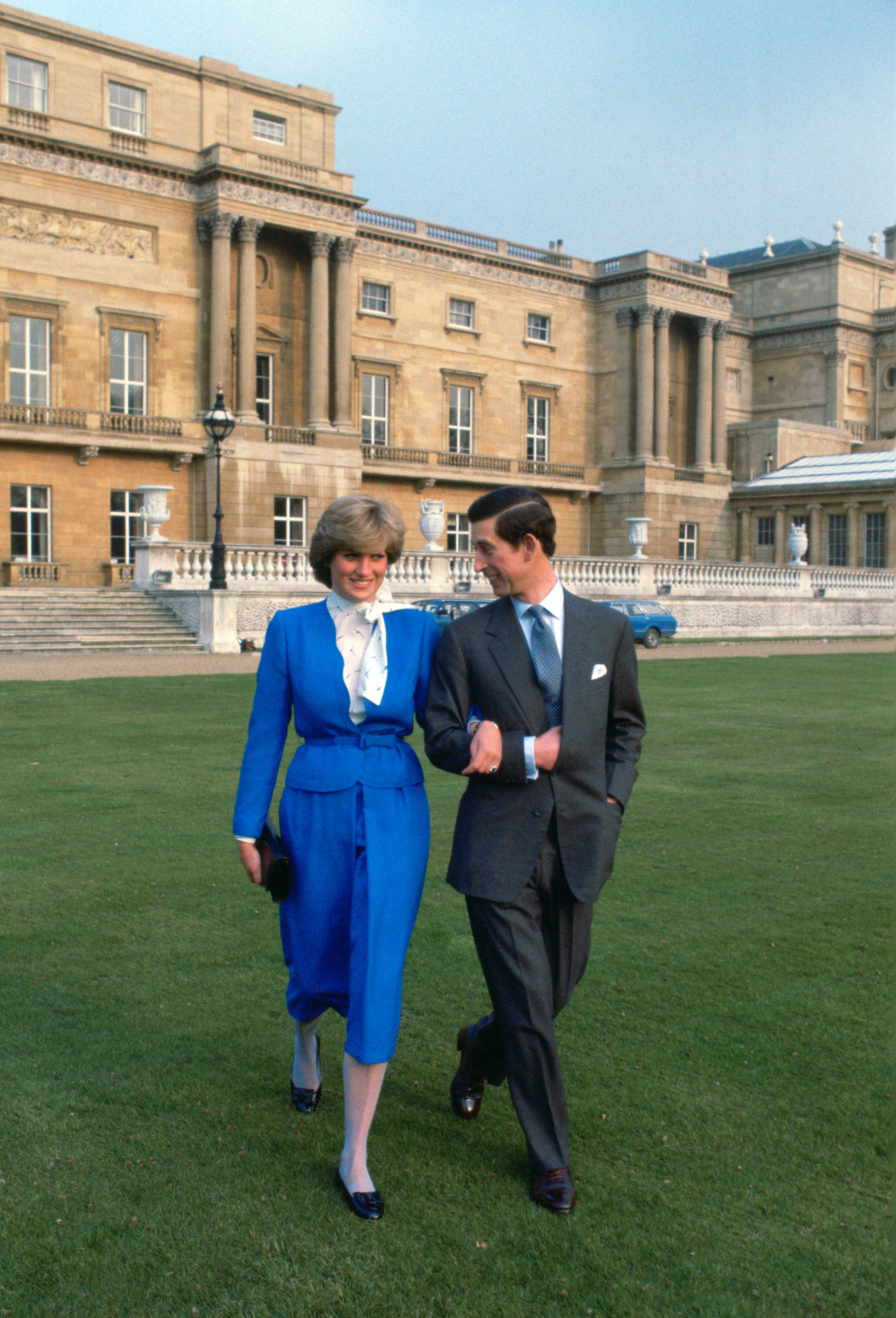 Princess Diana walking arm in arm with Prince Charles on their engagement photo shoot