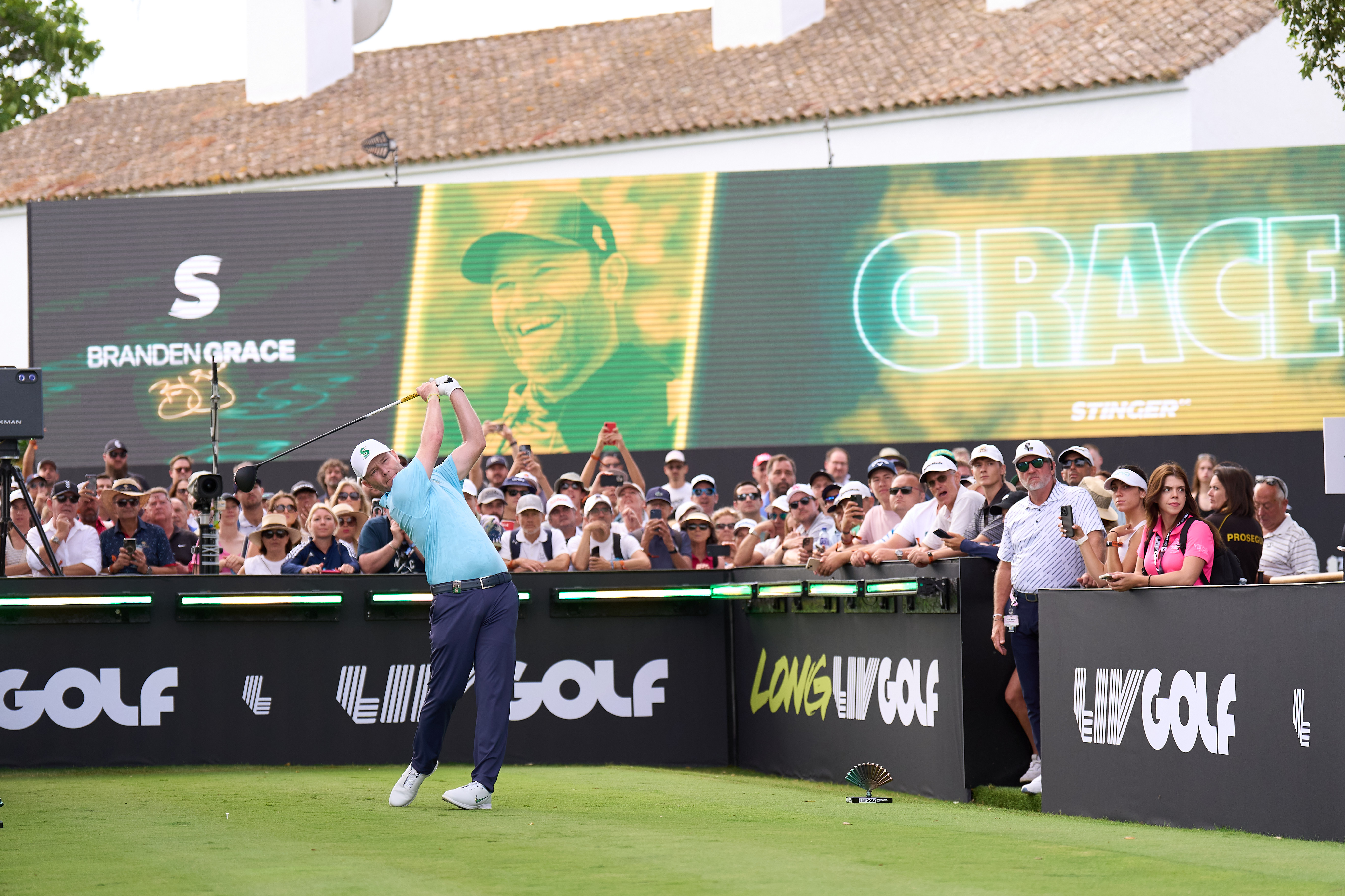 Branden Grace hits a tee shot with a driver