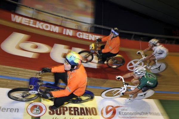 Kenny de Ketele slips through beneath Iljo Keisse in one of the derny races