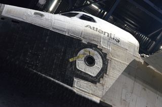 The body of the shuttle Atlantis, including its nose, bears the telltale marks of 33 missions to space and back, including nicks, dings, scratches and tracks that resulted from plunigng through Earth's atmosphere on its return trip.