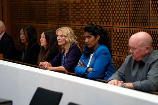 Denise Fox, Stacey Slater, Kathy Beale, Suki Panesar and Phil Mitchell sitting in a line in the courtroom in Dean's trial