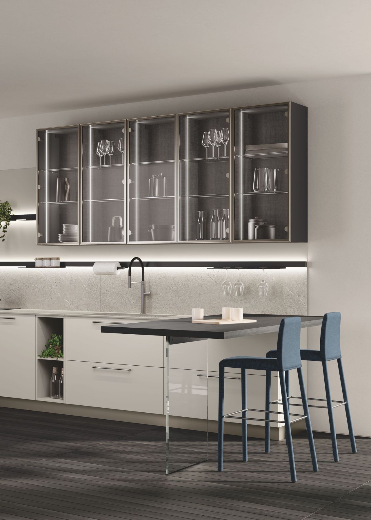 A glass footed countertop with bar stools beside it. There are also glass fronted cabinets with decor and kitchen accessories.