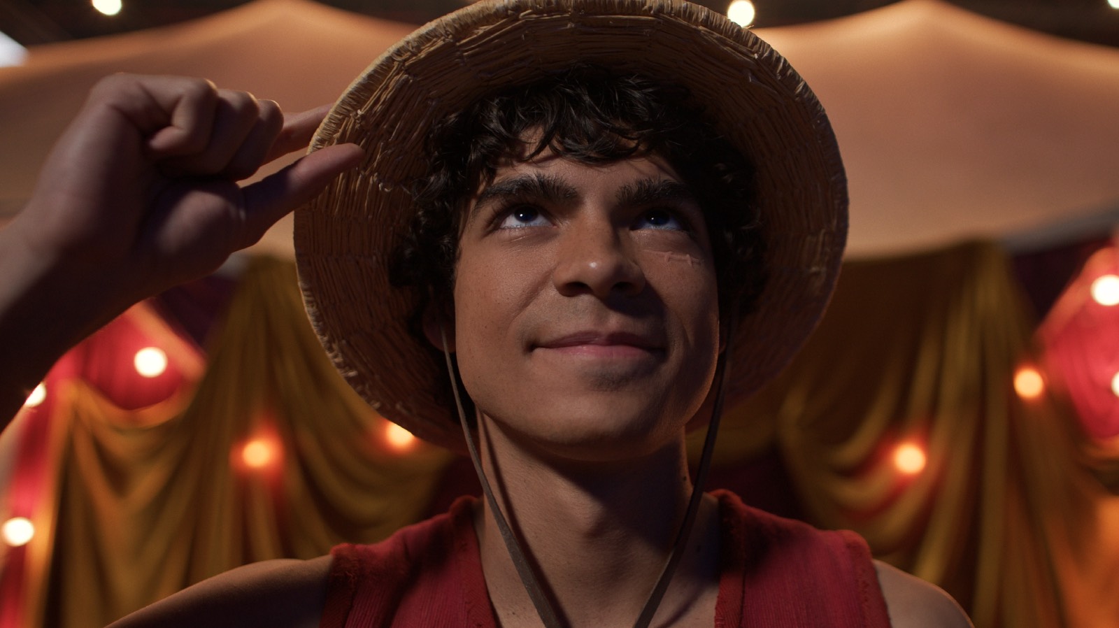 Monkey D. Luffy straightening his straw hat
