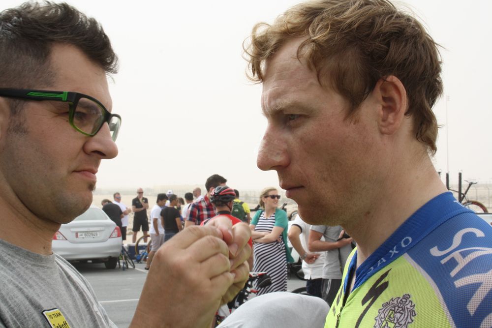 Pavel Brutt has a breath right nose-strip applied by a team helper