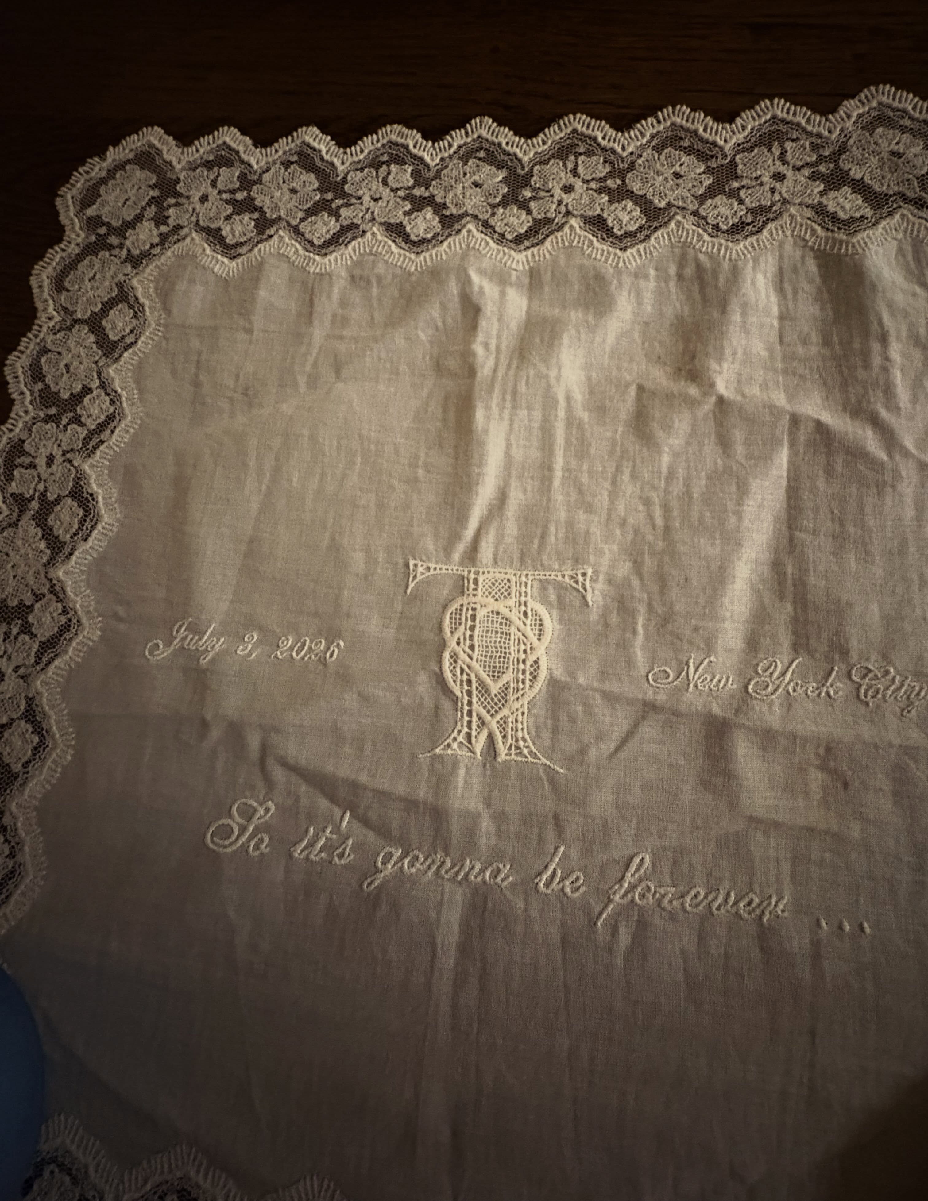 Maren Morris shares a souvenir from Taylor Swift and Travis Kelce's wedding, which is a white embroidered doily napkin featuring lyrics from Blank Space