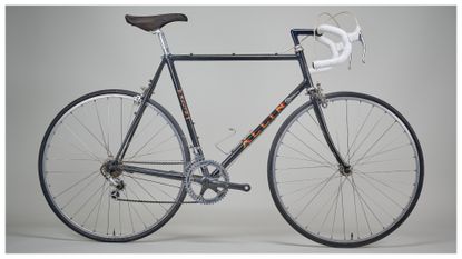 A classic Allin road bike in front a grey studio backdrop