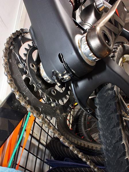 The front derailleur cable pops out of the frame just ahead of the bottom bracket shell.
