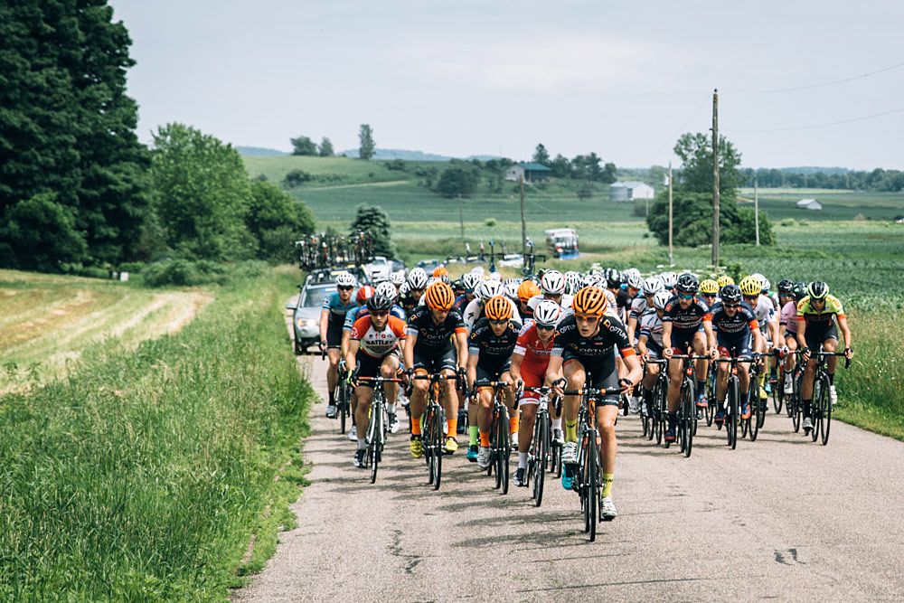 Optum Pro Cycling stays positioned near the front as the peloton approached the major climbs