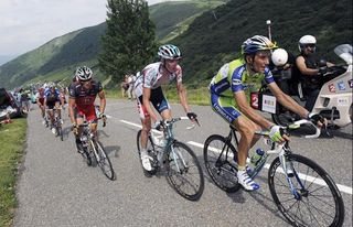 Ivan Basso, Jurgen Van Den Broeck and Lance Armstrong try to limit their time gap to Andy Schleck and Alberto Contador on the Col de la Madeleine.