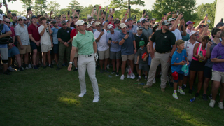 Rory McIlroy hits a shot in front of large crowds at the Tour Championship