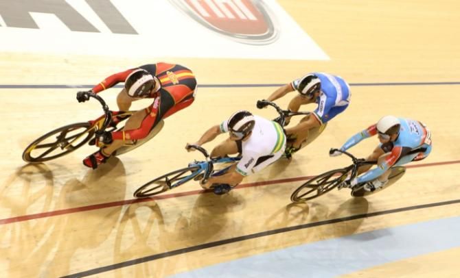 Australia's Andrew Taylor takes the inside line and holds firm to win round one of the men's Keirin