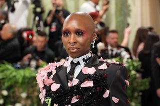 A woman, Cynthia Erivo, wears rose blush on the 2024 Met Gala red carpet.