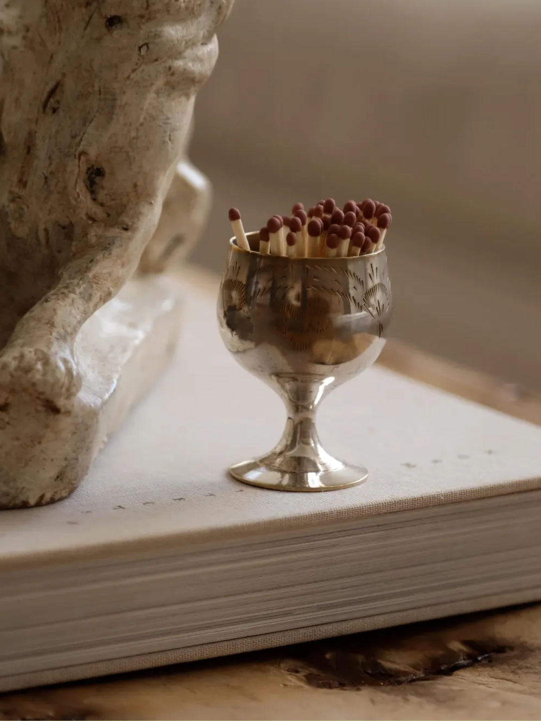 A silver vintage goblet match holder from Etsy