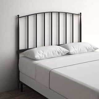 A charcoal colored metal headboard that's a part of Kelly Clarkson's furniture collection.