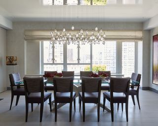neutral dining room with statement pendant light