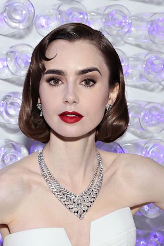 lily collins at the met gala with a 50s makeup look