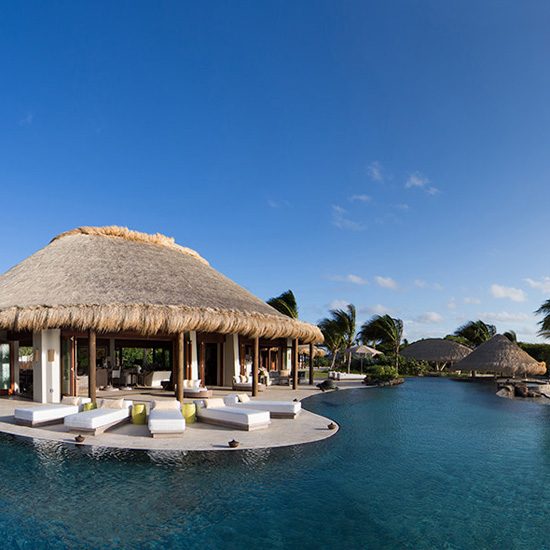 hut surrounded by swimming pool and trees