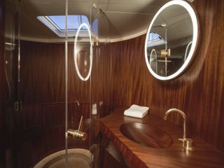 Sleek, wood-lined bathroom