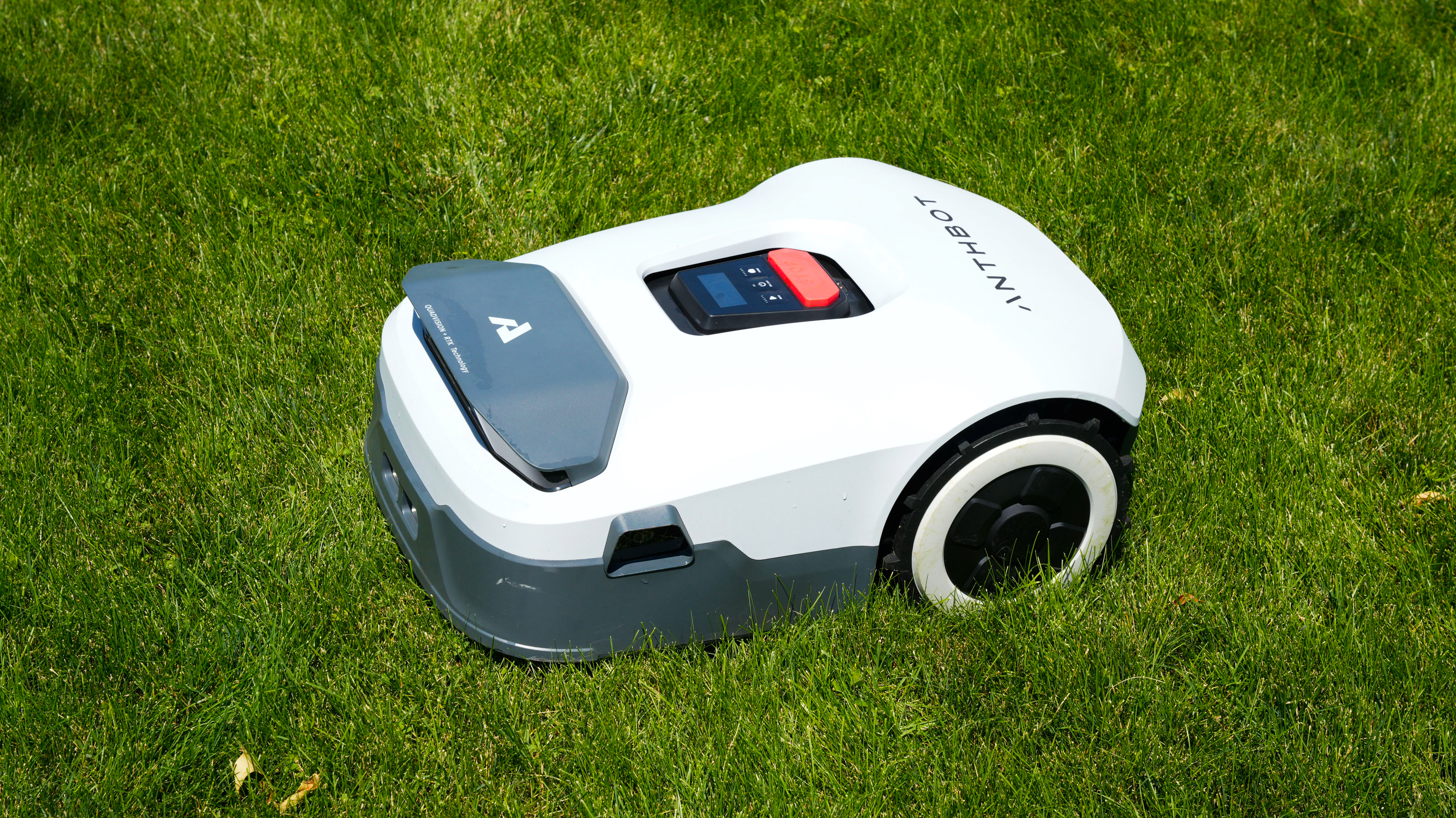 Anthbot Genie 3000 being tested in a bright green yard