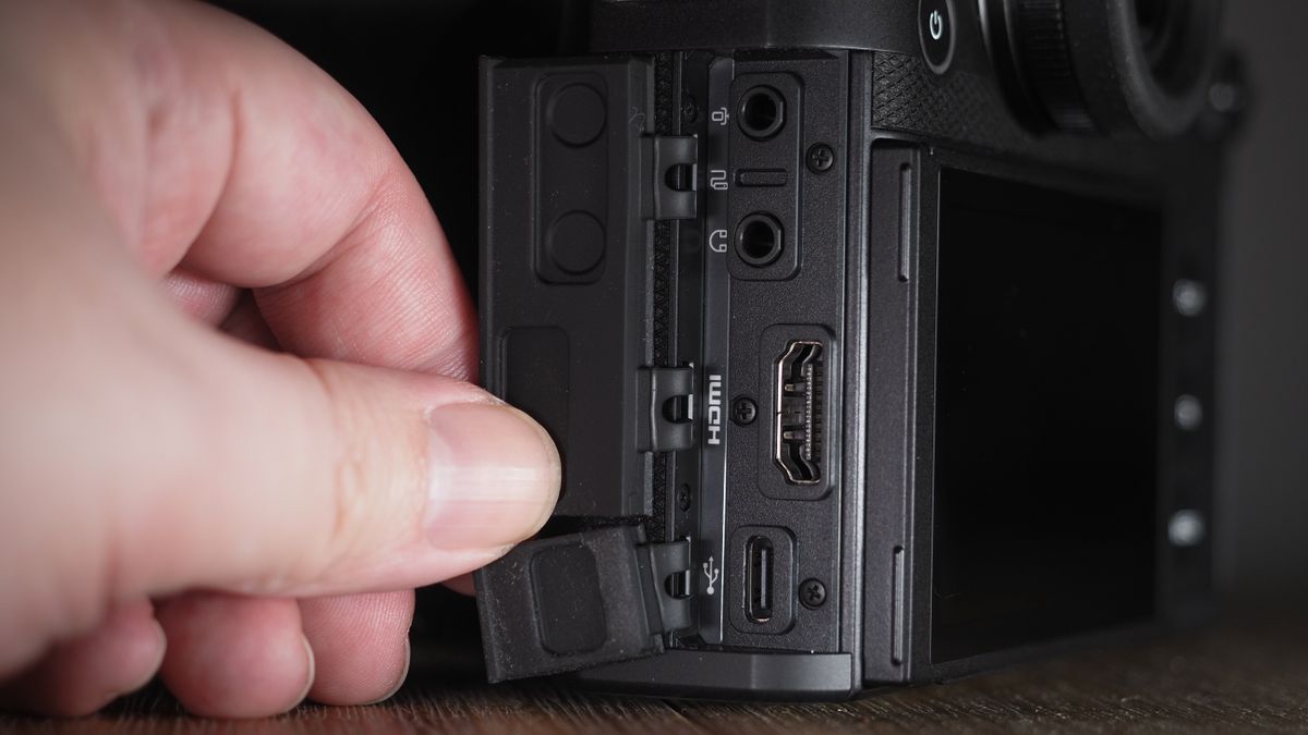 Leica SL3-S on a wooden surface with moody lighting