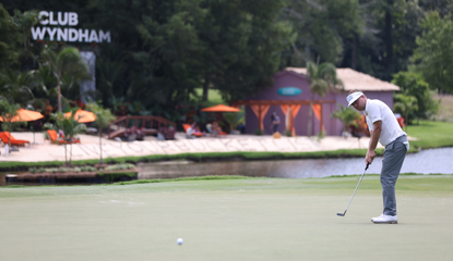 Keith Mitchell hits a putt