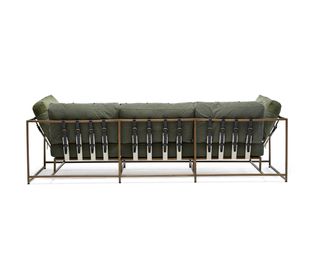 sofa in khaki green with belt detail on a steel frame