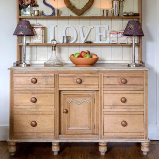 wooden dresser with fruit basket