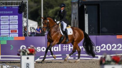 Germany’s Michele George scores 82.86% in the grade V freestyle to claim the gold medal at the World Para Dressage Championships