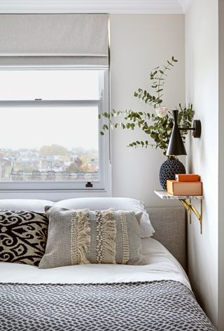 Small bedroom with floating shelf