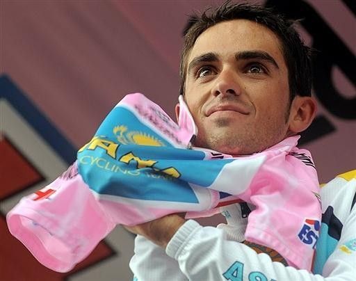 Contador beams with pride as he puts on another pink jersey.