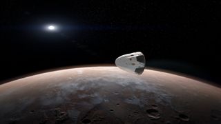 A SpaceX Red Dragon spacecraft is seen near Mars in this artist's concept of a private mission to the Red Planet. SpaceX plans to start launching Dragons to Mars as early as 2018.