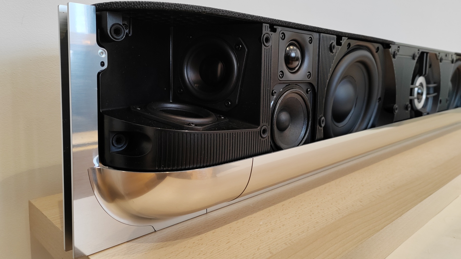 A close up of the Bang & Olufsen Beosound Theatre Dolby Atmos soundbar speaker system