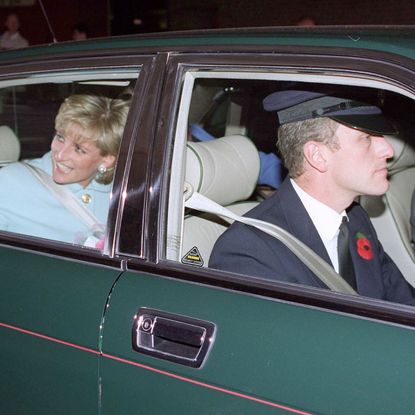 Princess Diana wears a baby blue jacket and waves from a green car being driven by her former chauffeur, Steve Davies