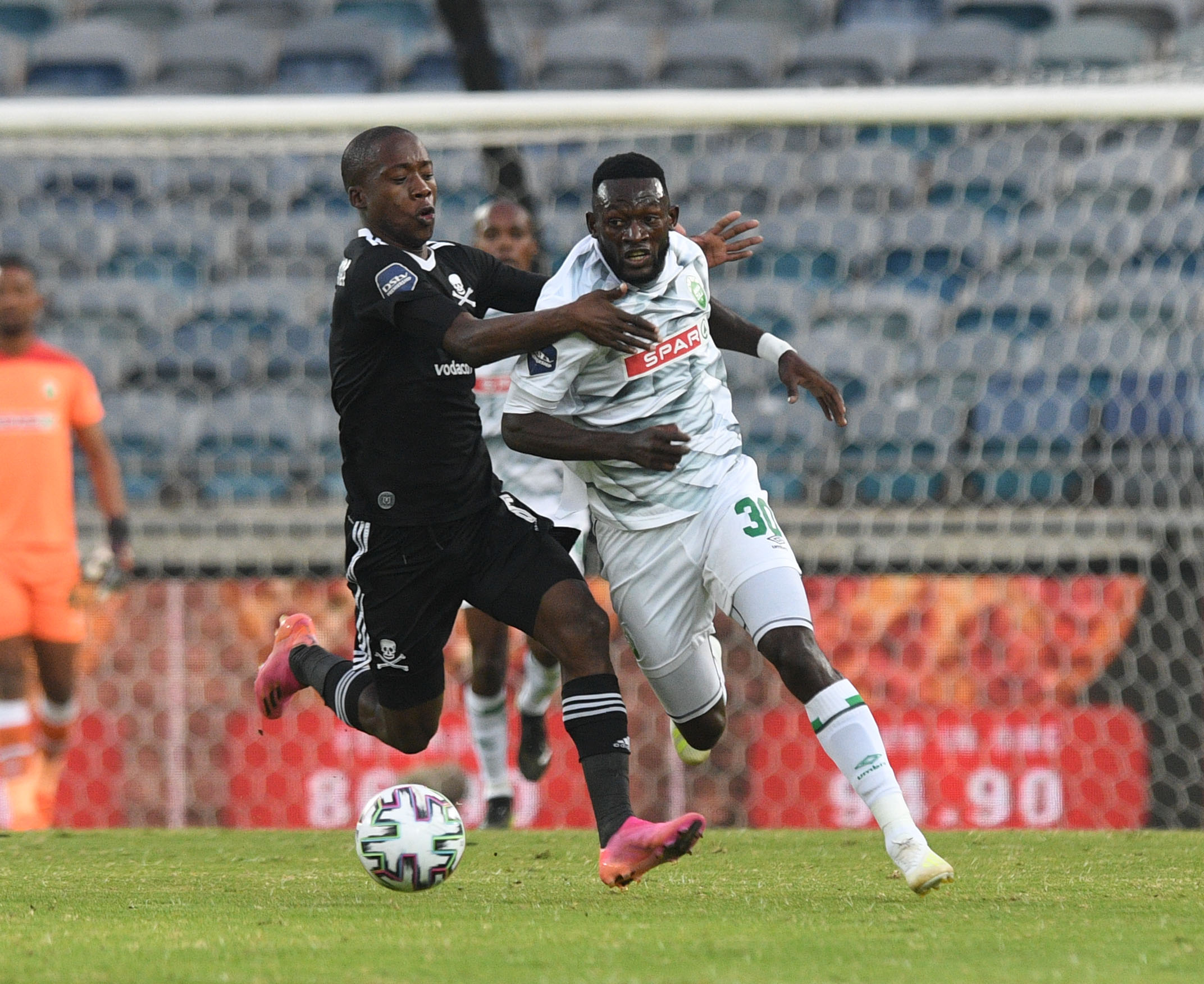 Augustine Mulenga of AmaZulu challenges Ben Motshwari of Orlando Pirates