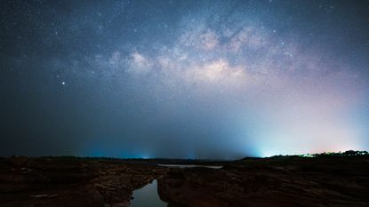 Starry night with the Milky Way Galaxy at Sam Pan Bok the sandstone formations along the Mekong river.