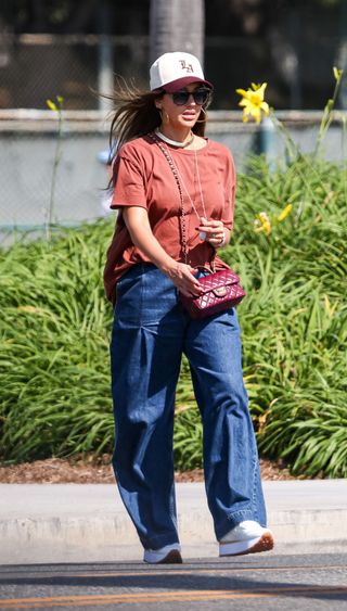 Jessica Alba wearing denim jeans, red t-shirt