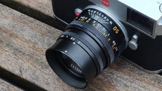 Leica 50mm Summicron-M f/2 with M11 on top of a park bench