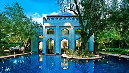 Reflection, Arch, Water feature, Majorelle blue, Swimming pool, Garden, Reflecting pool, Tourist attraction, Landscaping, Resort town, 