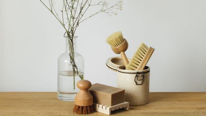 rustic cleaning products on a wooden table