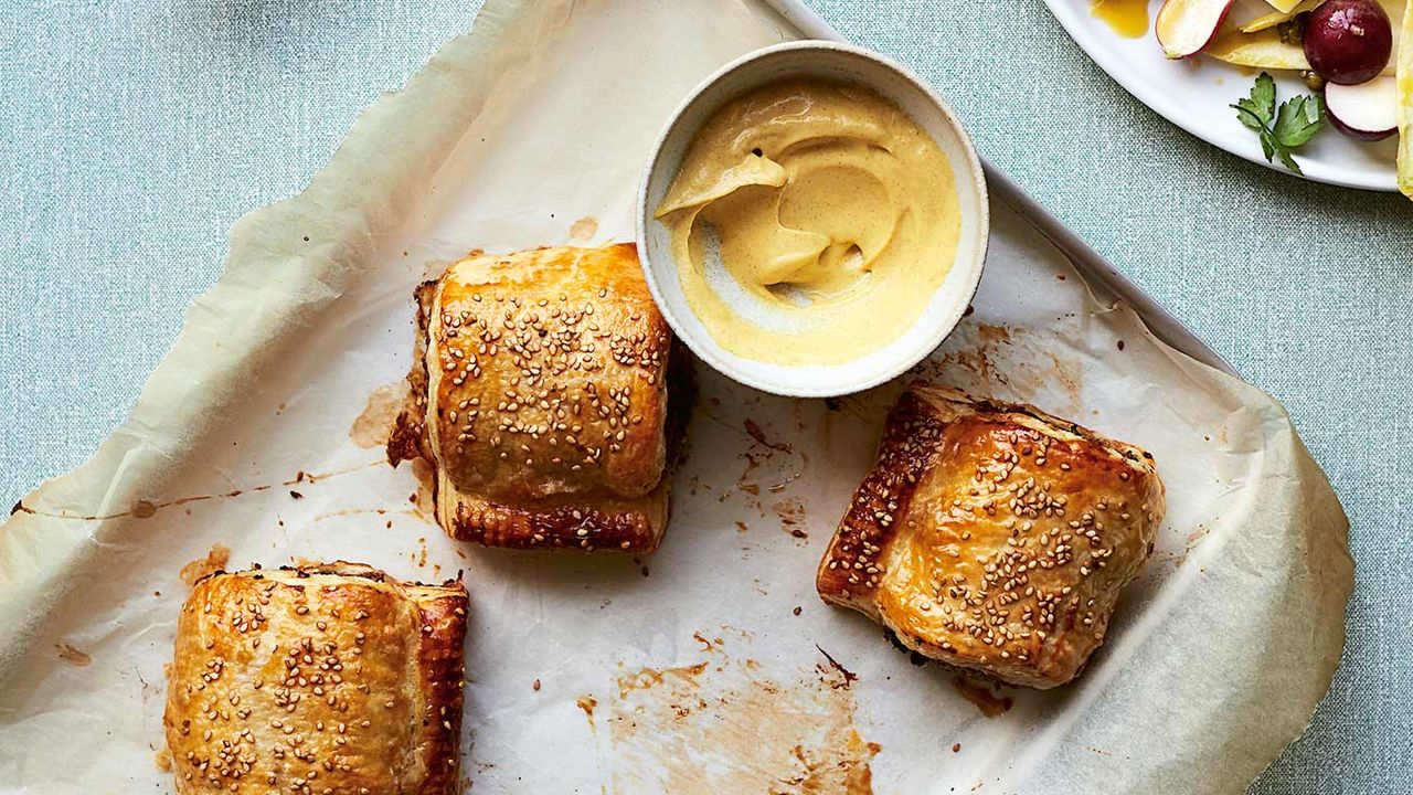 Prune and pork sausage rolls with a chicory salad